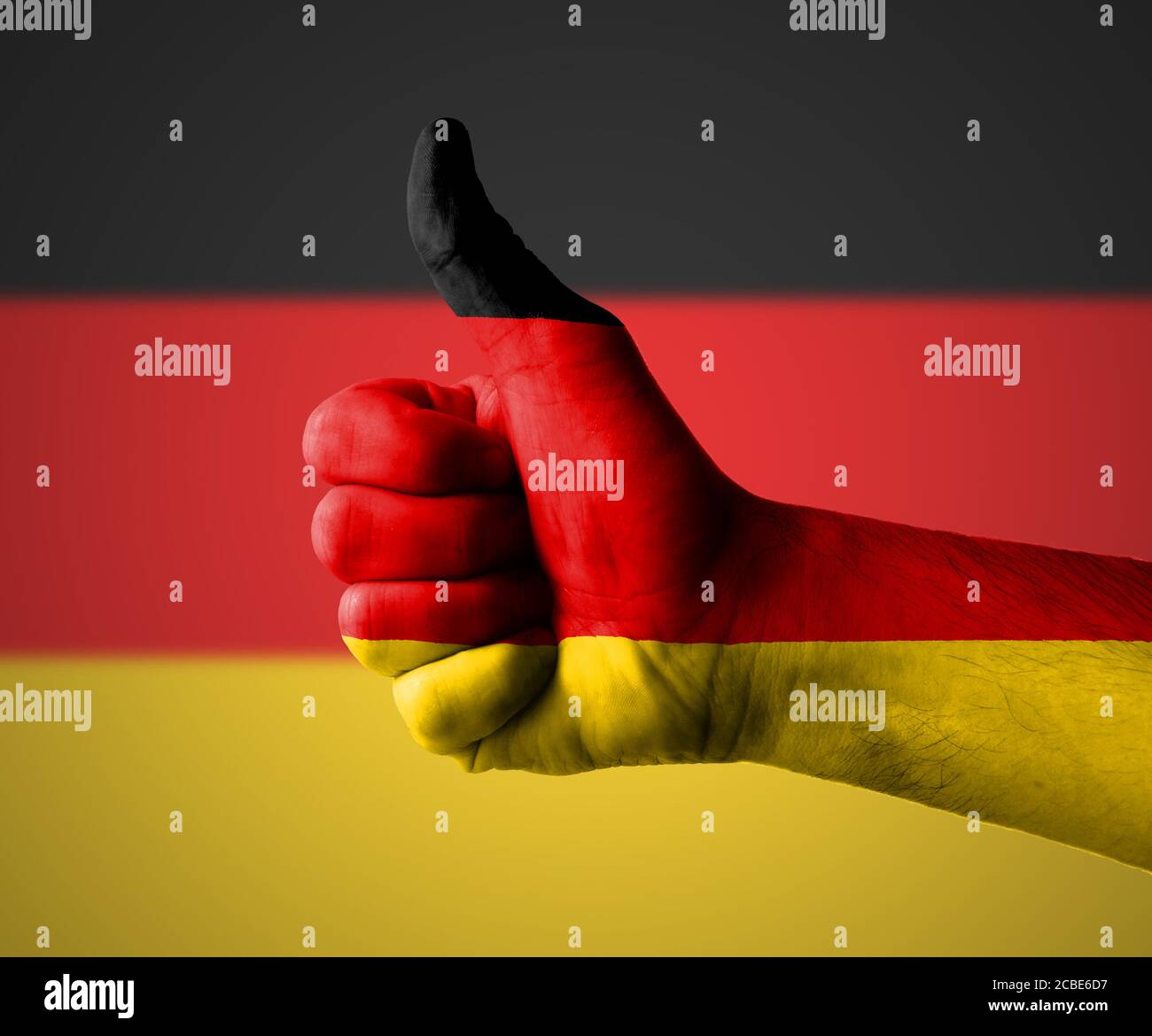 Hand with thumbs up for Germany Stock Photo