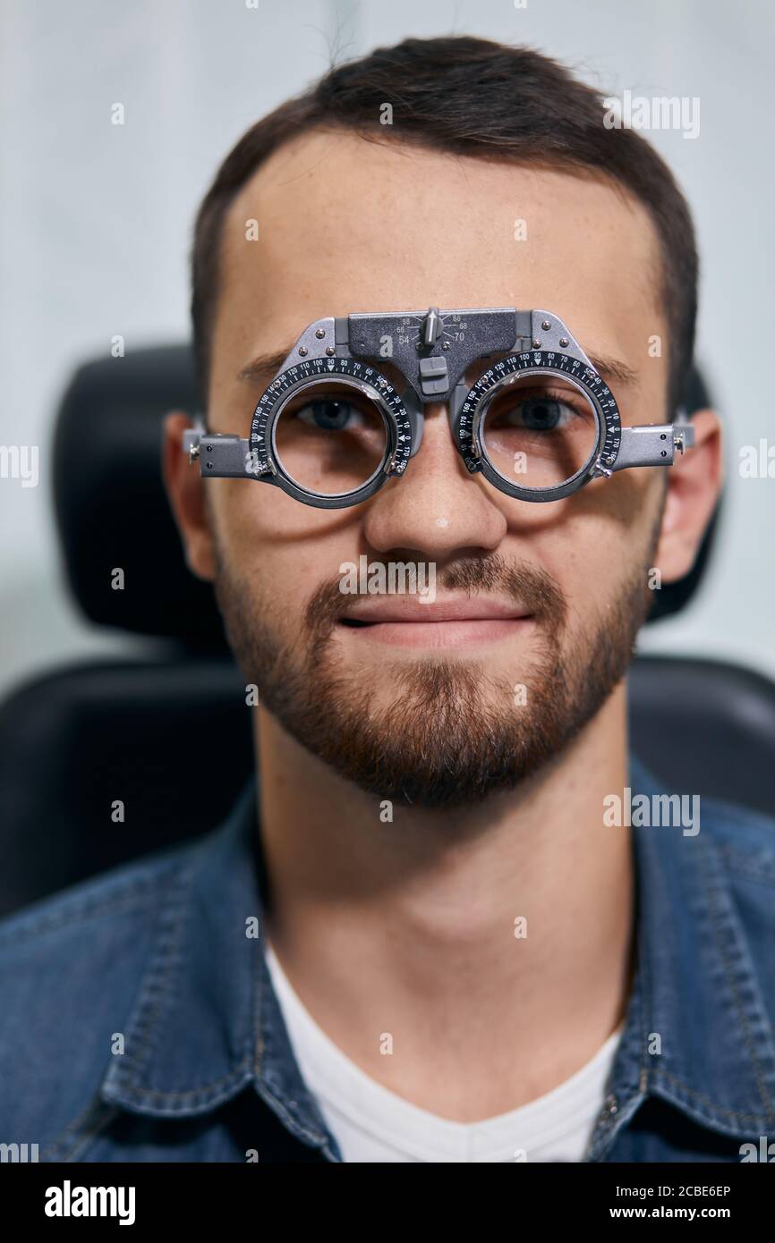 young man checking his eyesight, close up photo. medicine,
