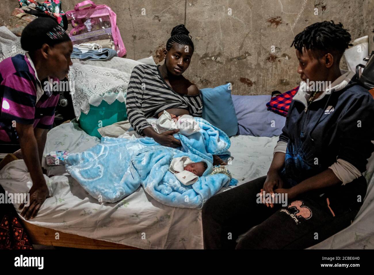 Nairobi, Kenya. 7th Aug, 2020. 19 year old single mother Rose Wateri is seen breastfeeding her twin daughters inside her house in Kibera Slums.Through breastfeeding, mothers in Kibera slums are able to protect their babies with a vital source of immune-boosting to enable the proper growth of their babies. Credit: Donwilson Odhiambo/SOPA Images/ZUMA Wire/Alamy Live News Stock Photo