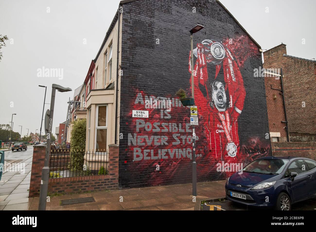 liverpool fc player jordan henderson with premier league trophy wall mural sybil road near anfield liverpool england uk Stock Photo