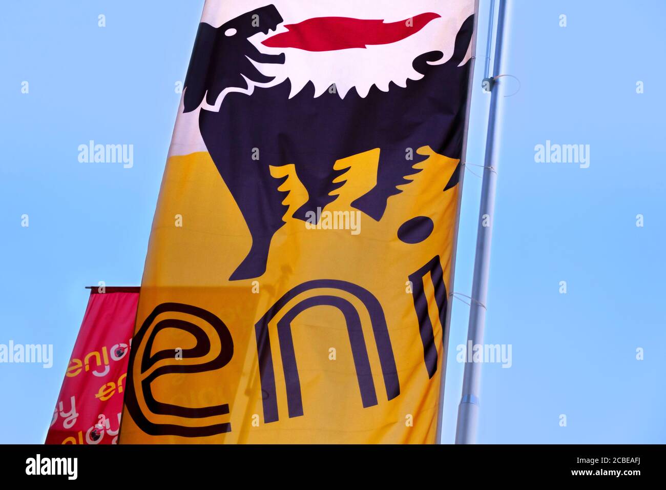 The logo of the italian oil and gas company ENI (Ente Nazionale Idrocarburi) waving on a flag.Eni is considered as one of the supermajor oil company. Stock Photo