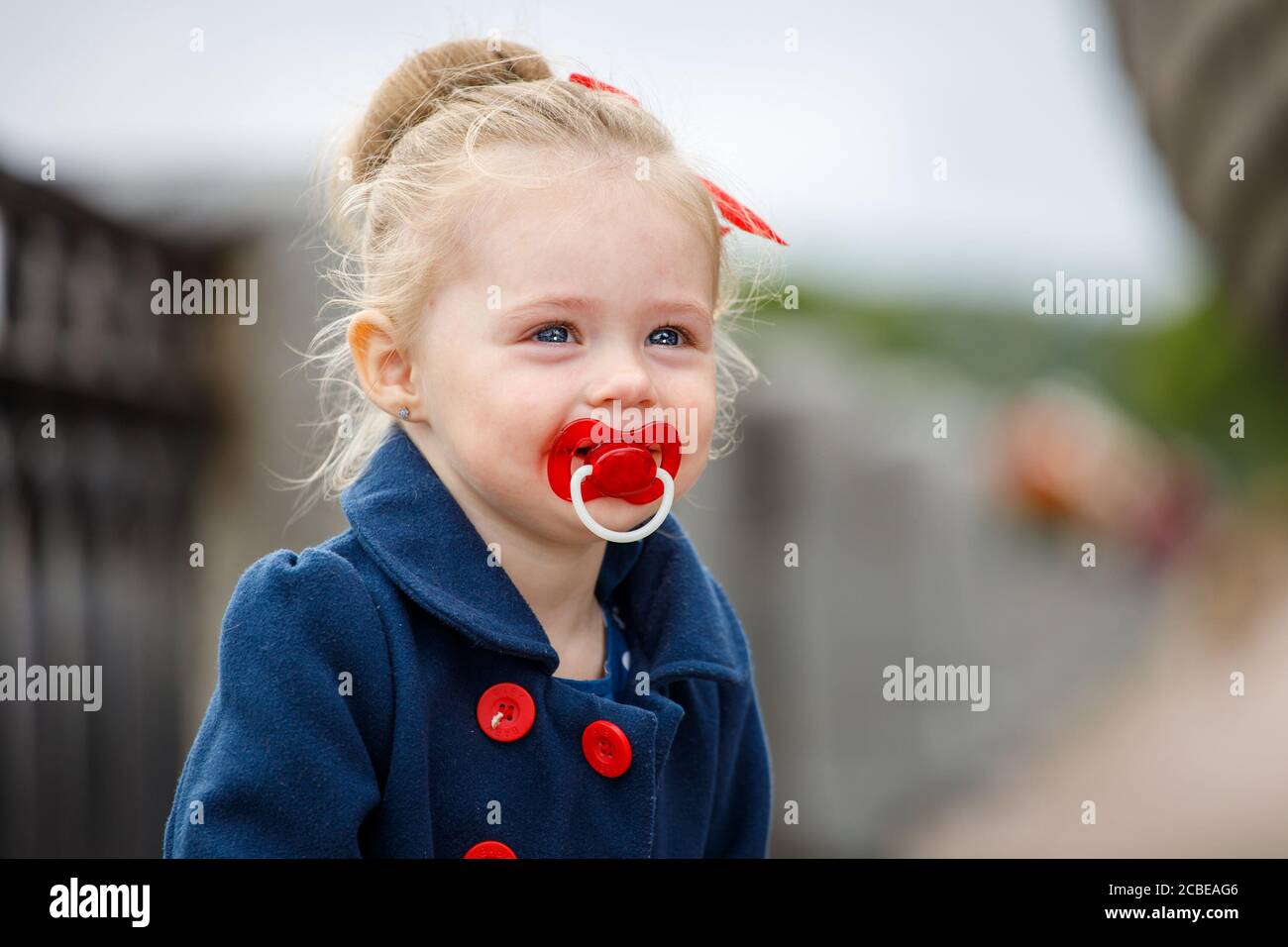 Girl sucking pacifier hires stock photography and images Alamy