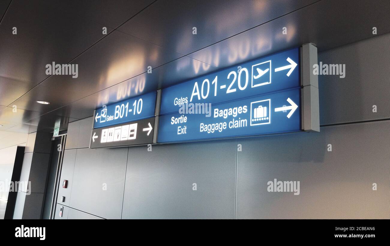 Blue terminal location indicators signs at the airport Stock Photo Alamy