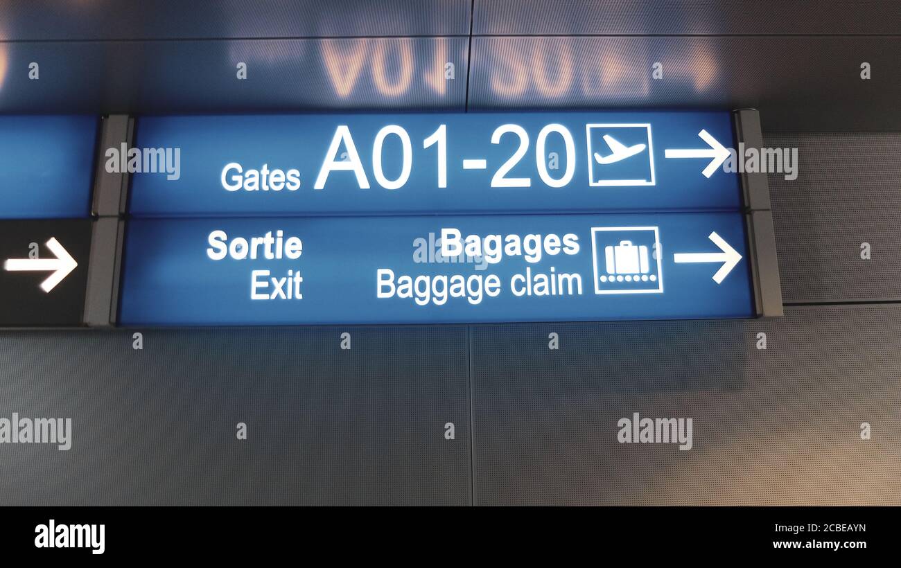 Blue terminal location indicators signs at the airport Stock Photo Alamy
