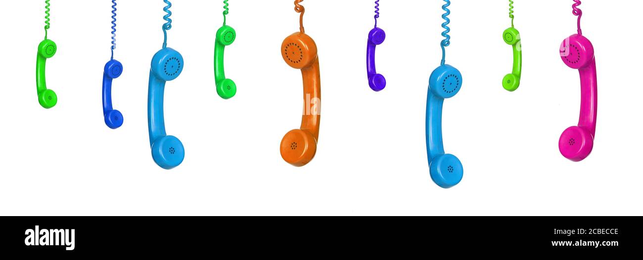 Row of old handsets hanging on white background Stock Photo