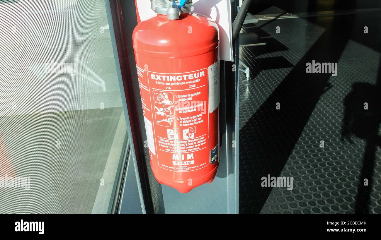 Red tank of fire extinguisher. Fire extinguishing system Stock Photo