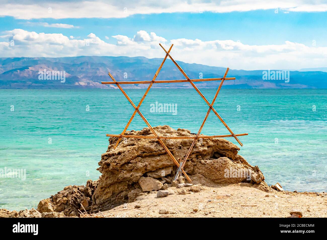 Wooden Shield of David (Magen David or Star of David) with the Dead Sea in the background Stock Photo