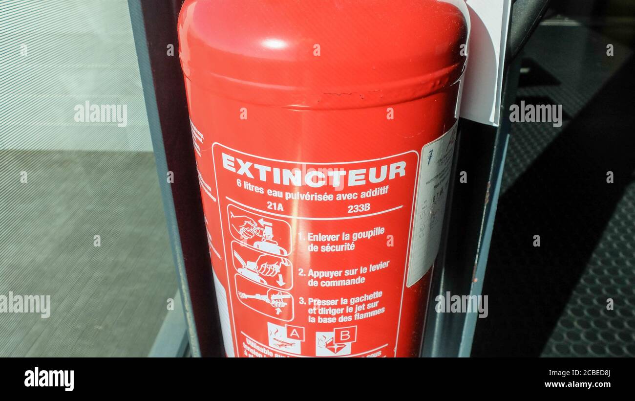 Red tank of fire extinguisher. Fire extinguishing system Stock Photo