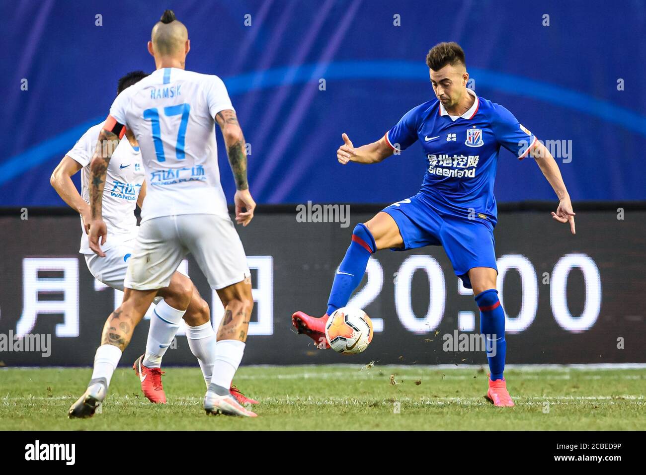 Italian football player Stephan El Shaarawy of Shanghai Greenland Shenhua  F.C., right, protects the ball during the fourth-round match of 2020  Chinese Super League (CSL) against Dalian Professional F.C., Dalian city,  northeast, image size:1300x956