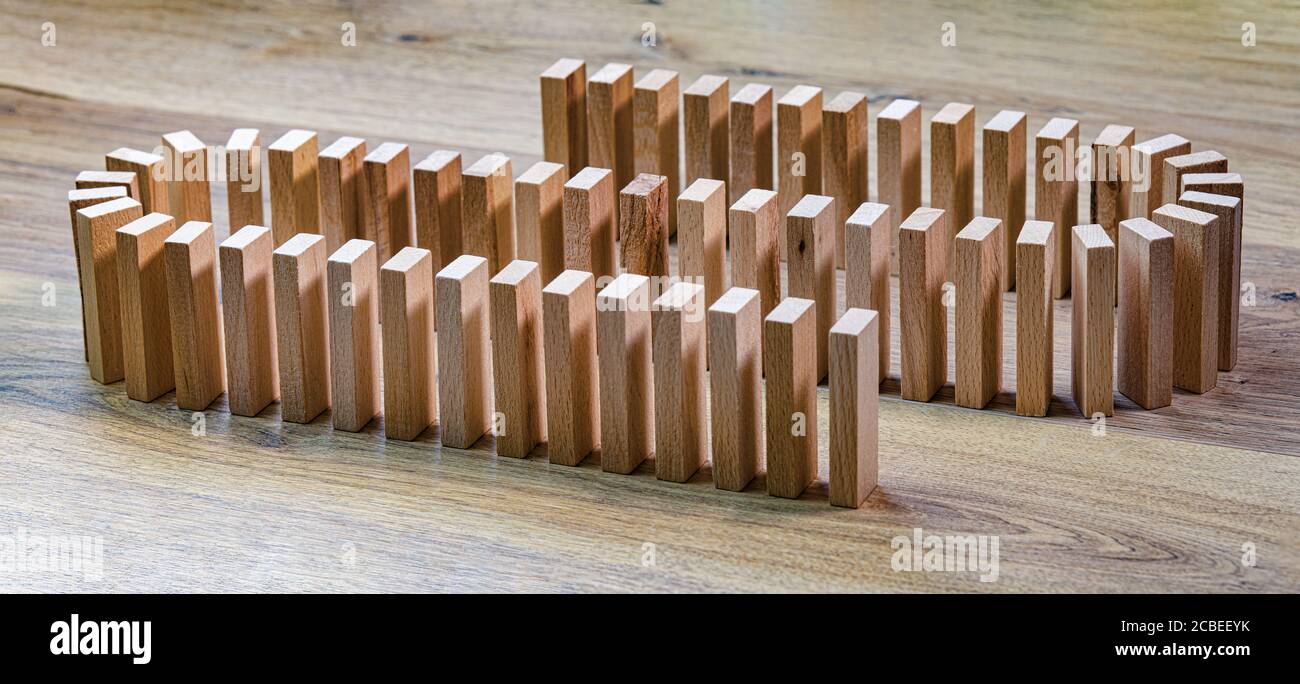 lined wooden dominoes, on wooden top, panorama banner Stock Photo