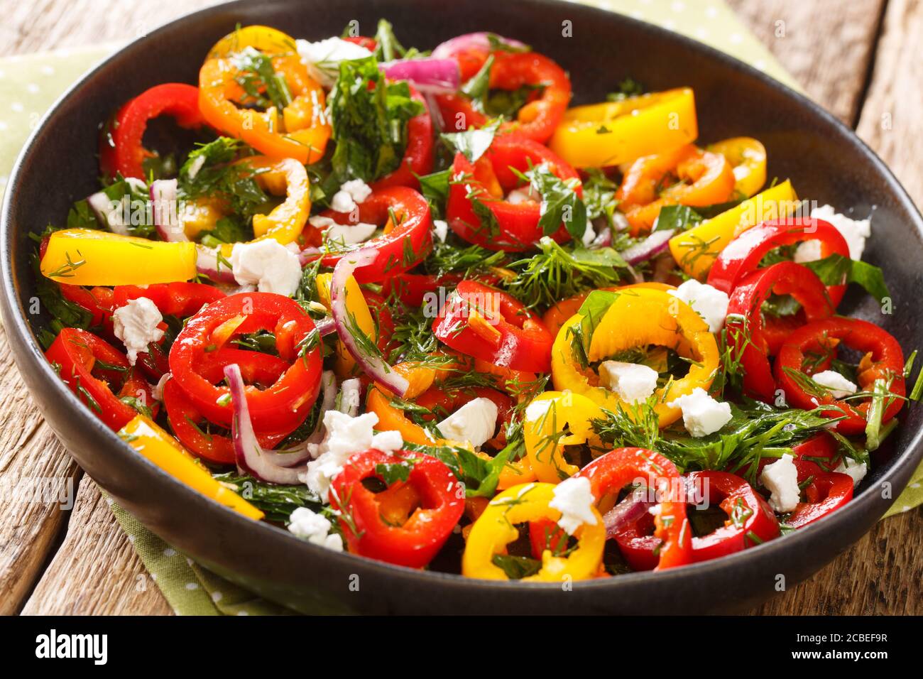 Vitamin Mediterranean bell pepper salad with onions, herbs and feta
