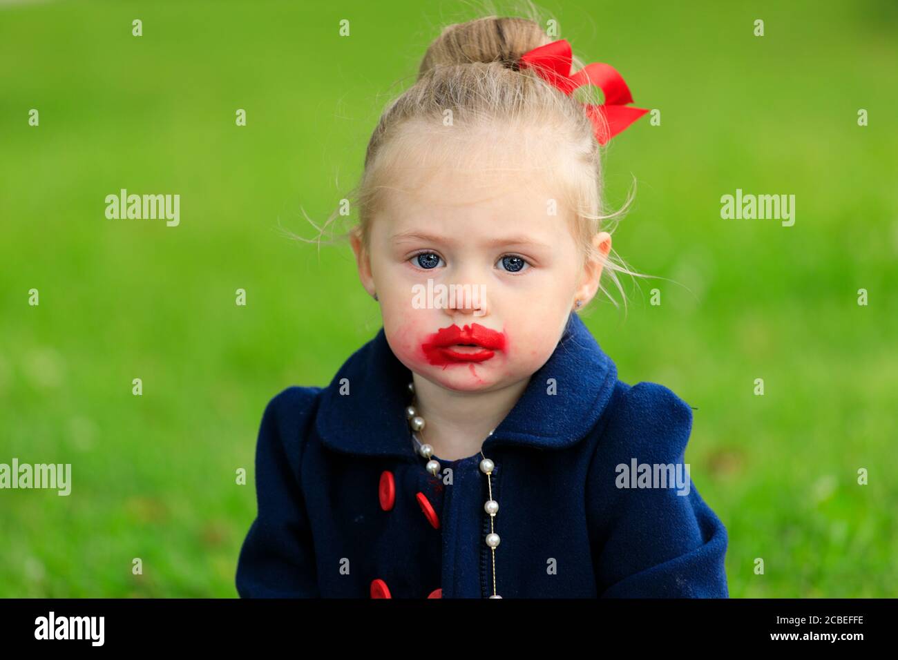 girl with lipstick on her face Stock Photo Alamy