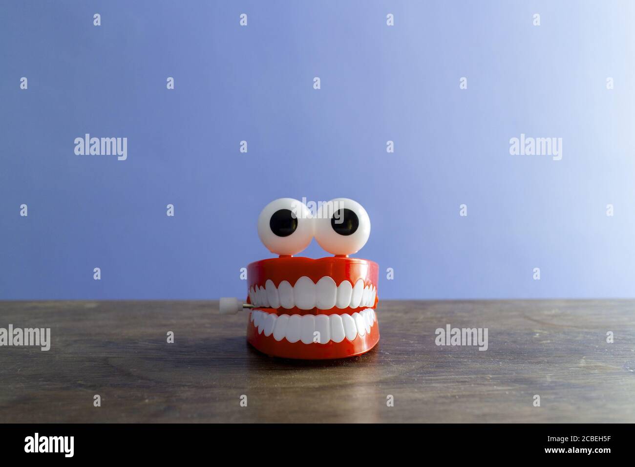 Set of chattering toy teeth with eyes, looking like a cartoon character or mascot Stock Photo