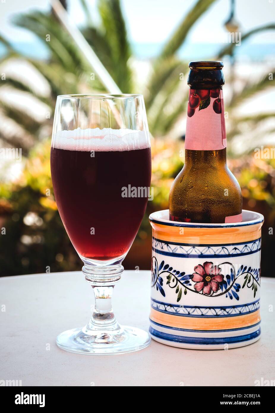 A cherry beer in glass and bottle Stock Photo Alamy
