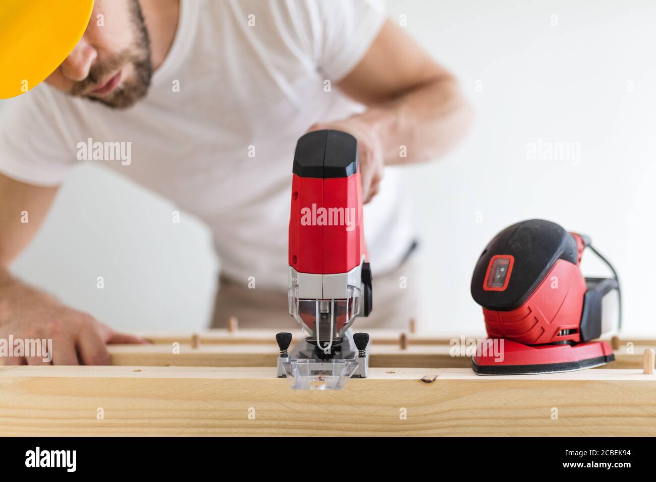 Male carpenter working on a project in his workshop Stock Photo
