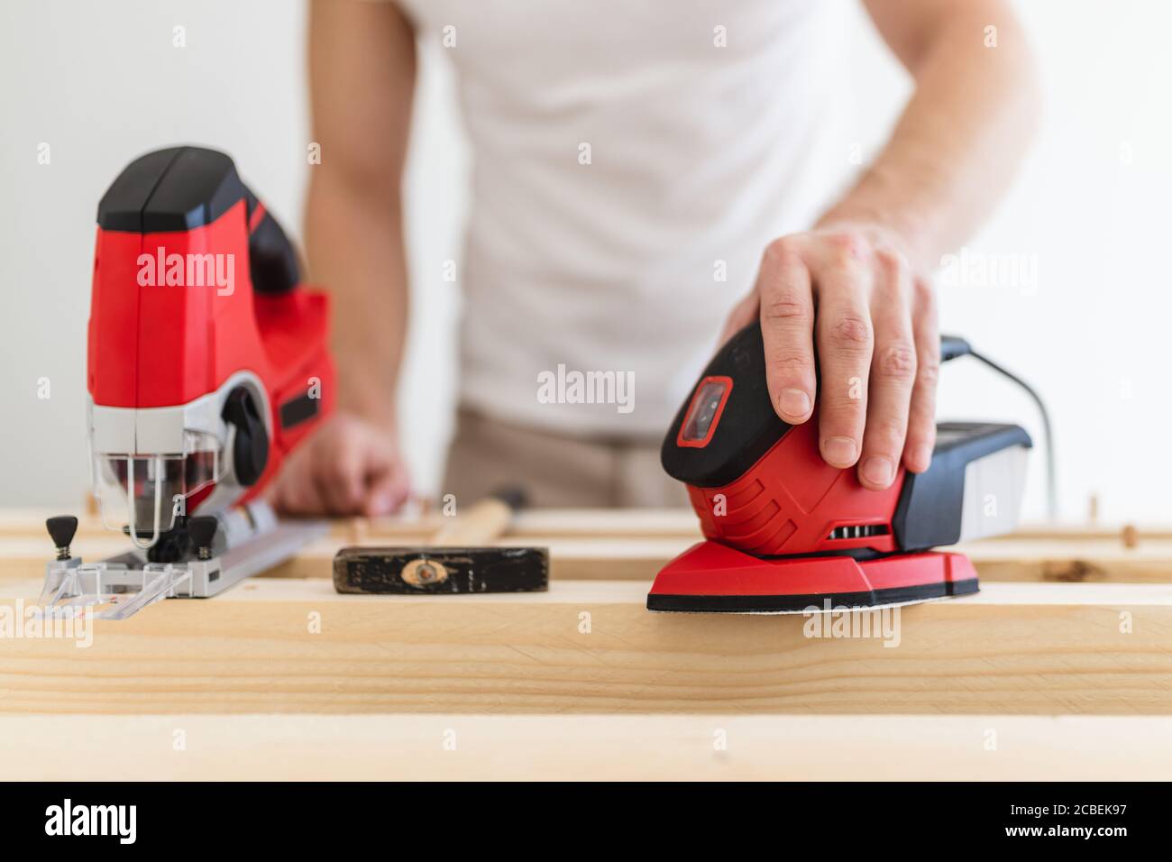 Male carpenter working on a project in his workshop Stock Photo