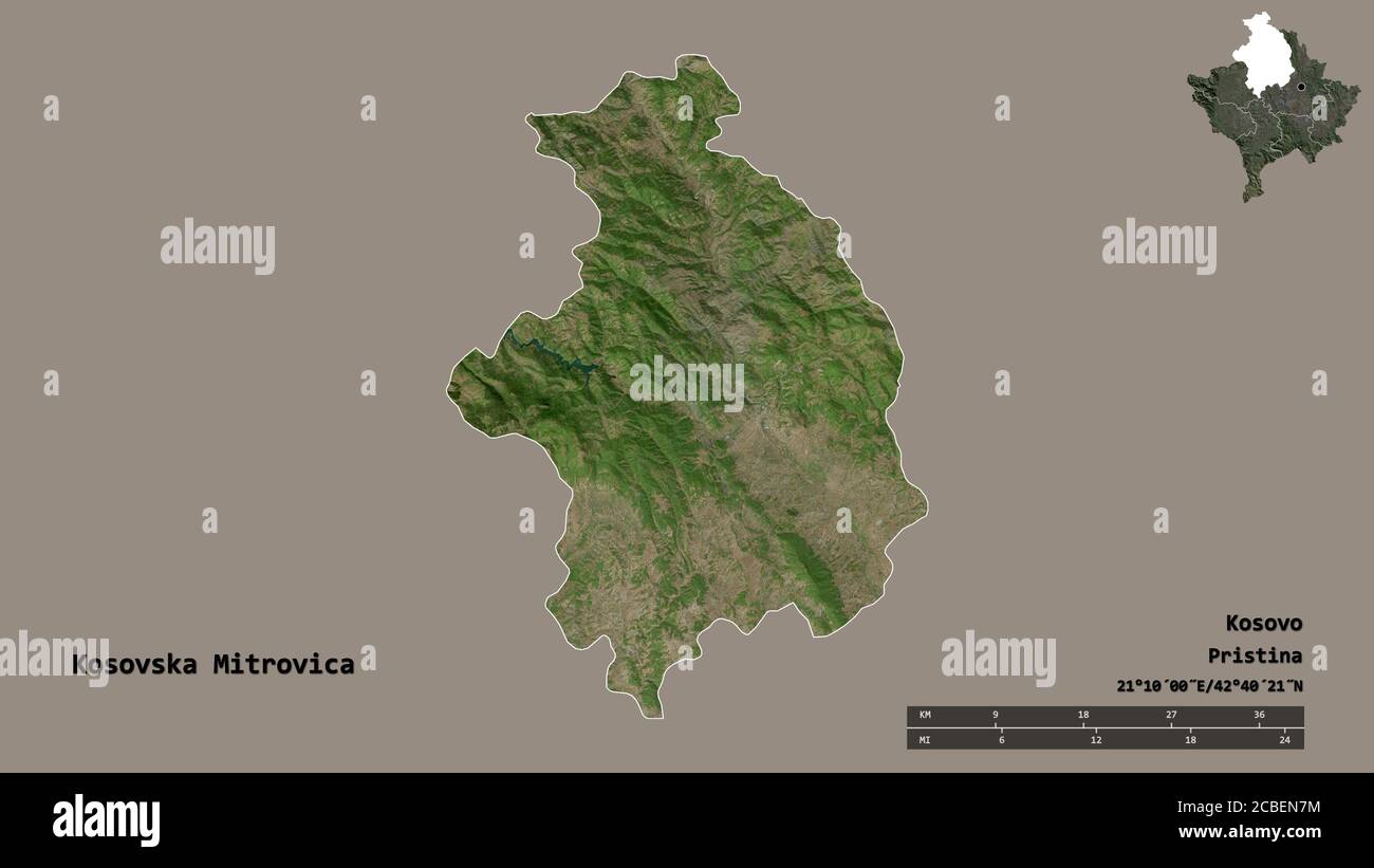 Shape of Kosovska Mitrovica, district of Kosovo, with its capital isolated on solid background. Distance scale, region preview and labels. Satellite i Stock Photo