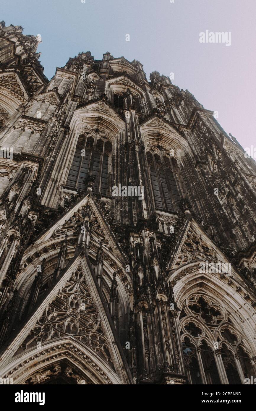 Low angle shot of the Cologne Cathedral in Germany Stock Photo - Alamy