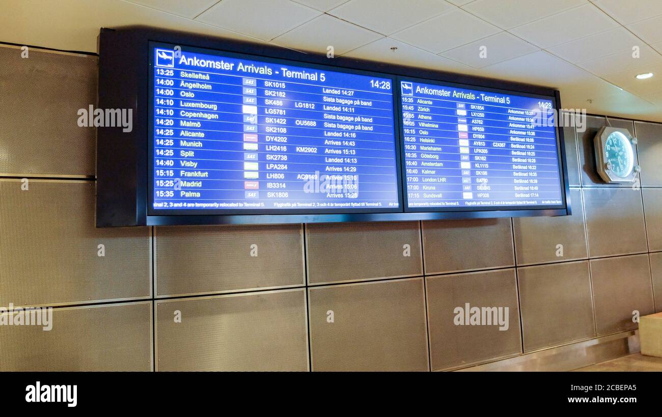 Blue terminal location indicators signs at the airport Stock Photo Alamy
