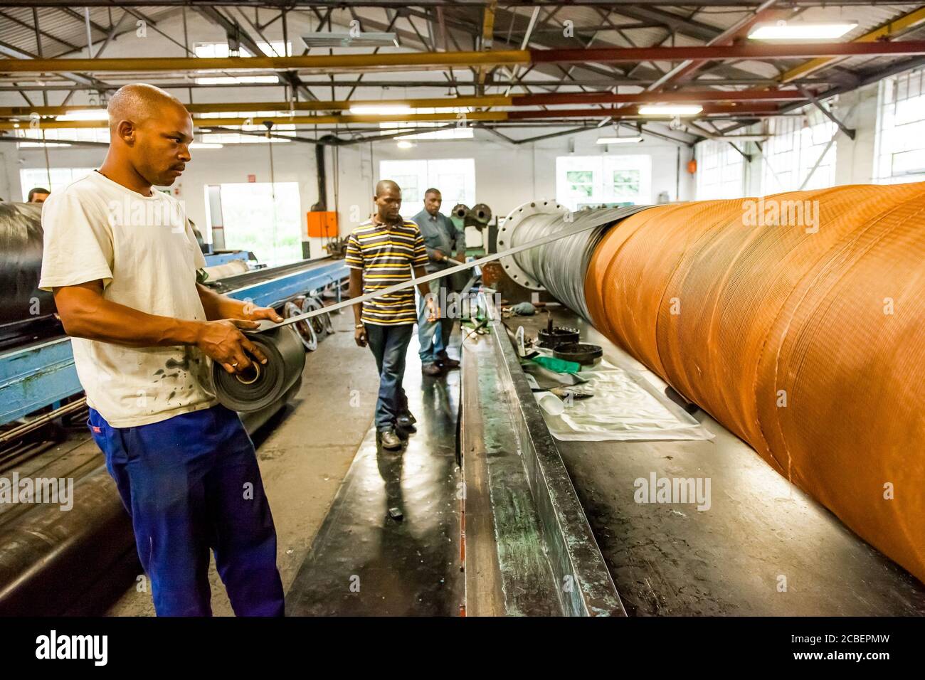 Johannesburg, South Africa - October 19, 2012: Diverse workers inside a ...