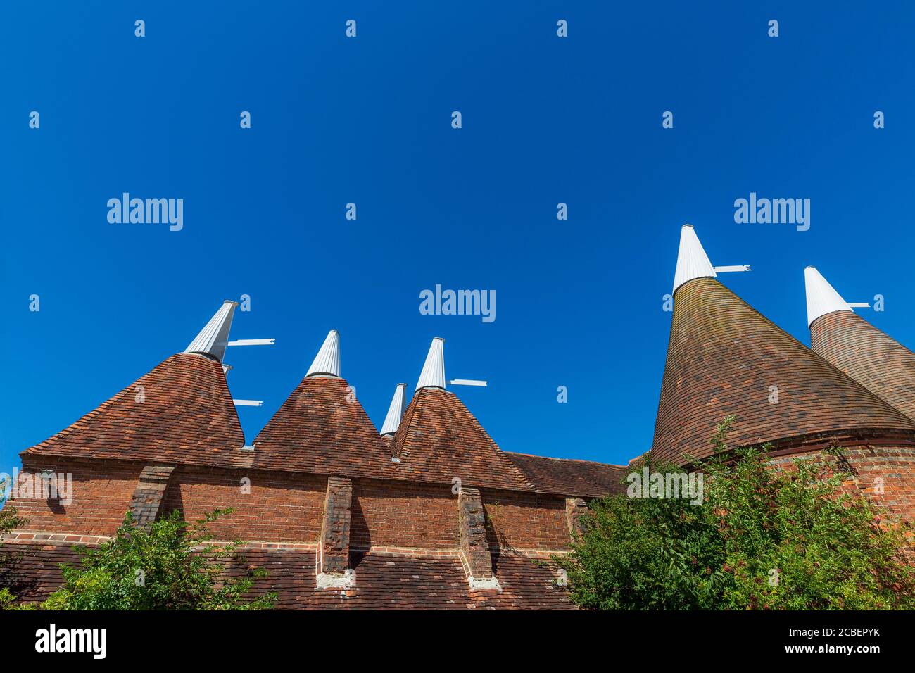 A brick Oast house in the Kent countryside, England Stock Photo