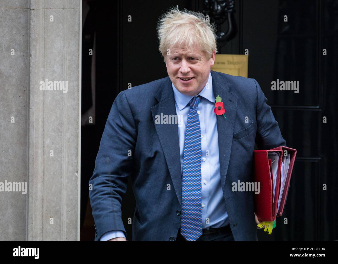 Prime Minister Boris Johnson leaves 10 Downing Street with red folders ...