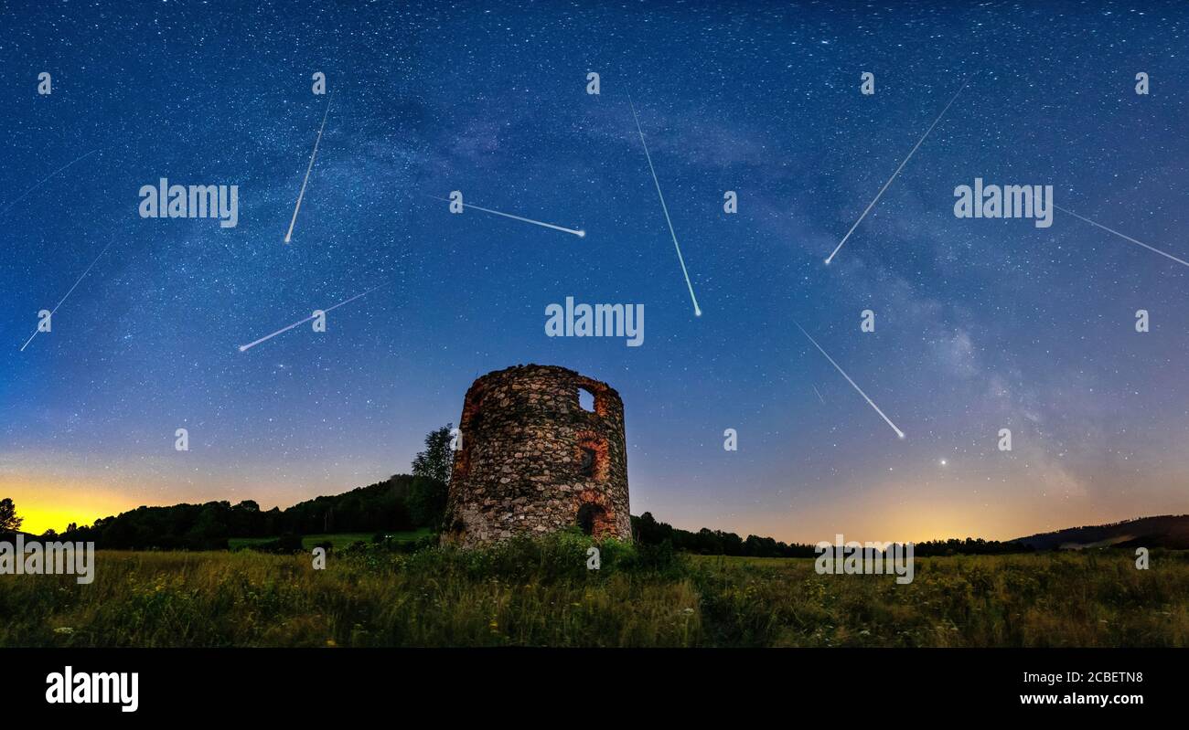 Meteor Shower and the Milky Way with old ruin on foreground Stock Photo