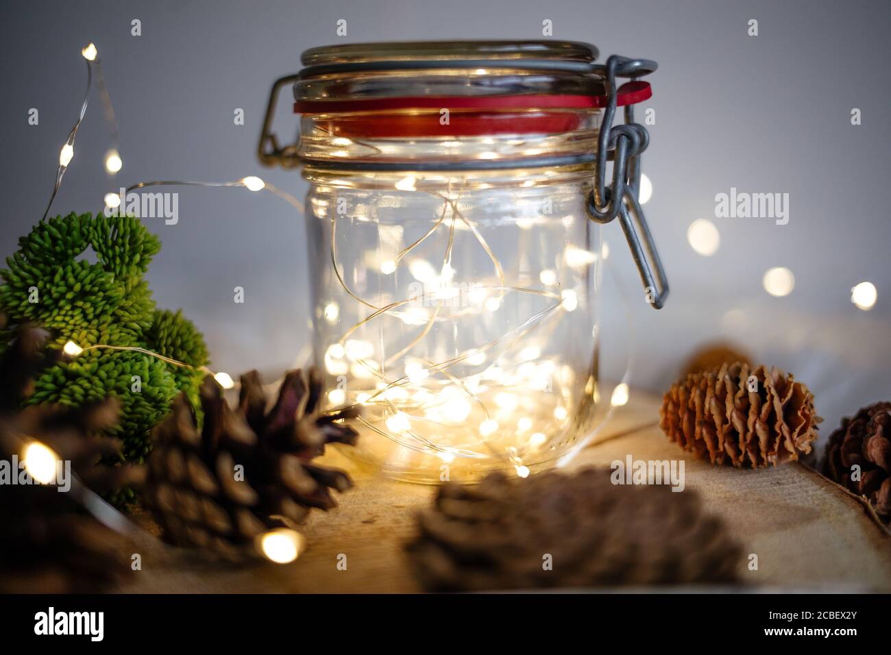 A Closeup Shot Of Christmas Tree Bumps And Lights In A Jar On A Table Stock Photo Alamy