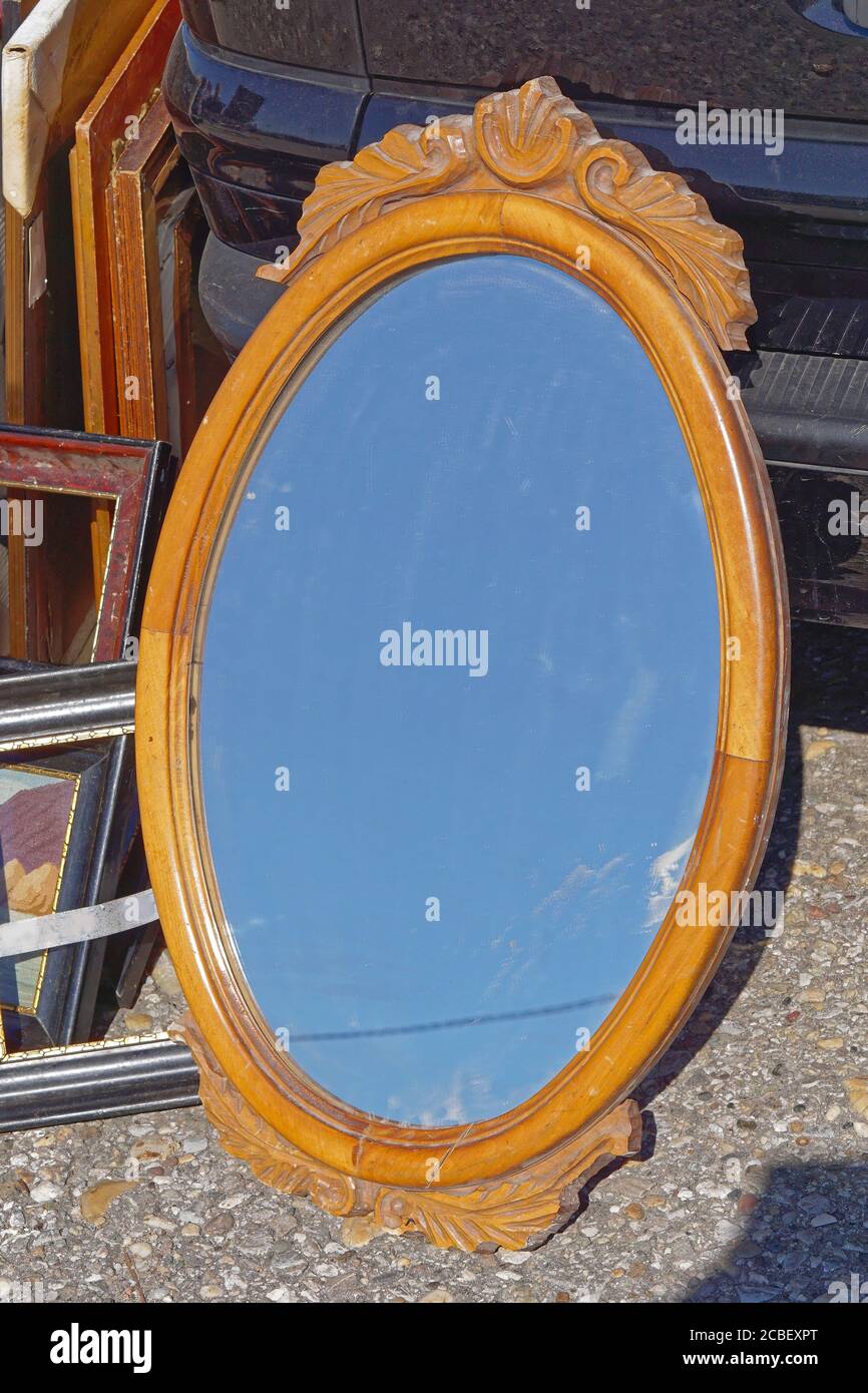 Carved rustic wood oval mirror frame Stock Photo - Alamy
