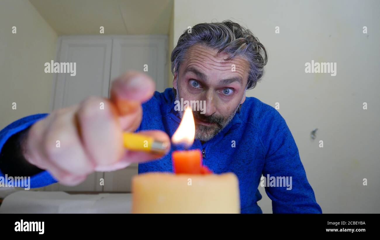 Male lighting a birthday candle Stock Photo Alamy