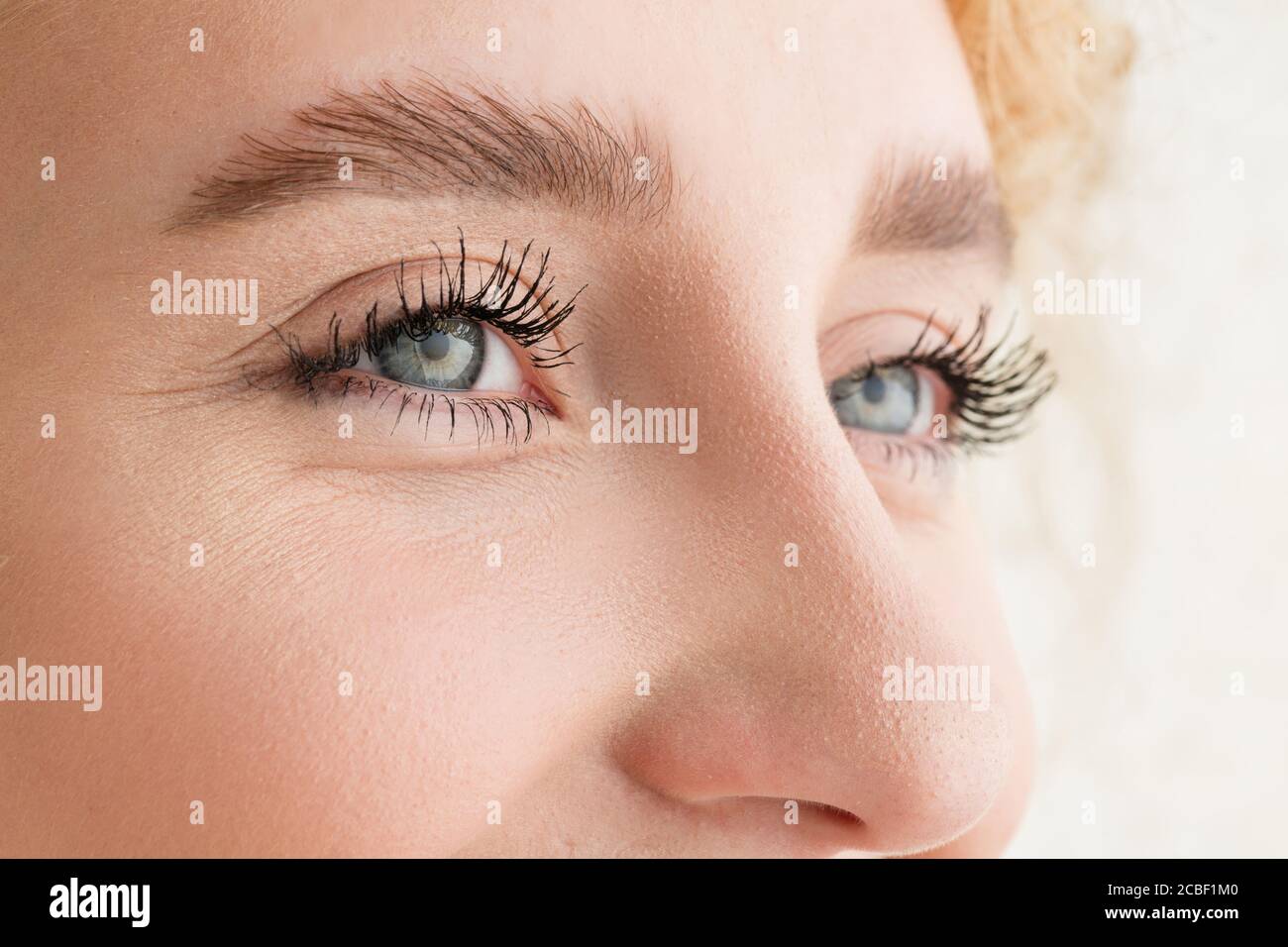 Laughting. Close up of face of beautiful caucasian young woman, focus ...