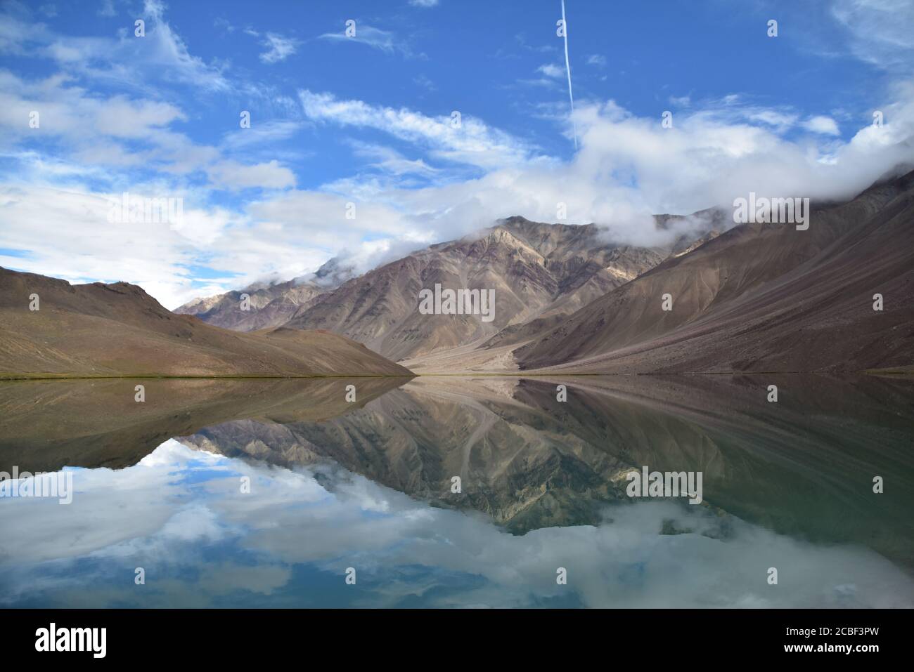 Chandra Taal or Moon lake is a Himalayan lake (alt 4300 mt) located in Spiti Valley, Himachal Pradesh, India. It is known for its perfect reflection. Stock Photo
