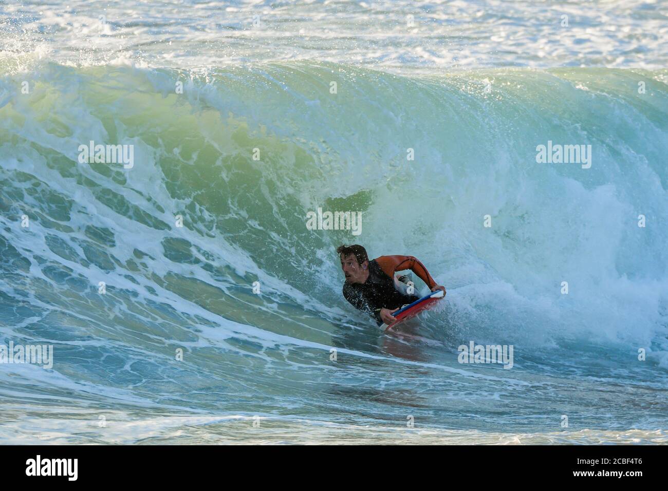 Bodyboarder in action on the ocean waves on a sunny day Stock Photo - Alamy