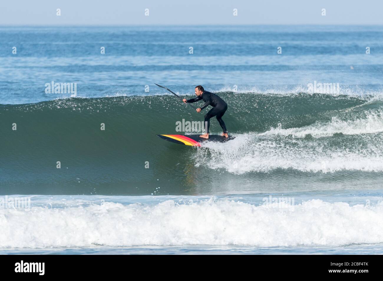 Stand up paddle surfer on the atlantic ocean Stock Photo Alamy