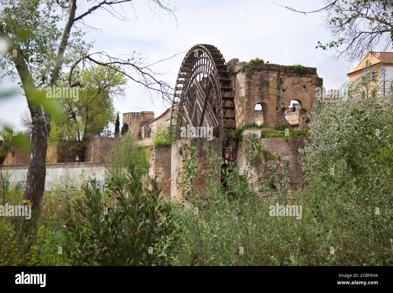 The resurrected old water wheel adjacent to the bridge at Cordoba Stock Photo