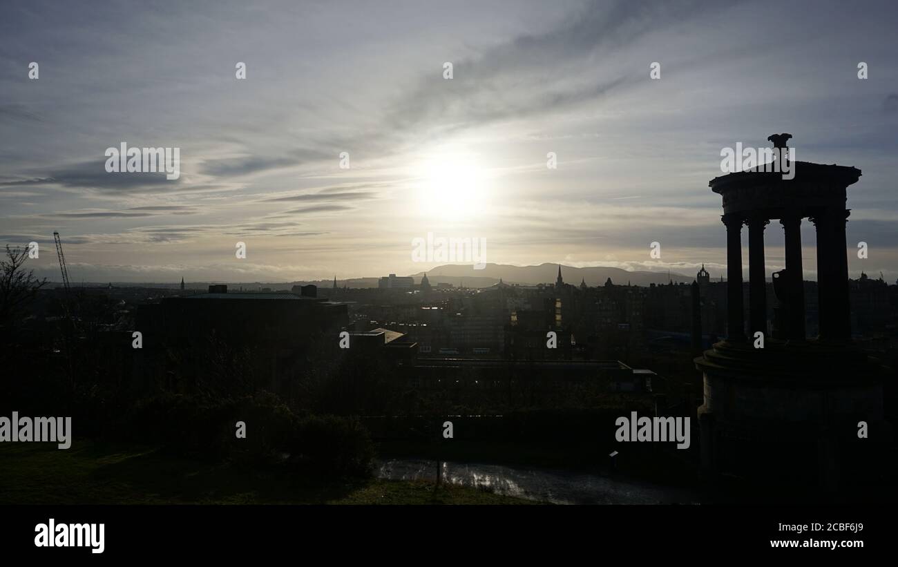 Sunset over old buildings Stock Photo - Alamy