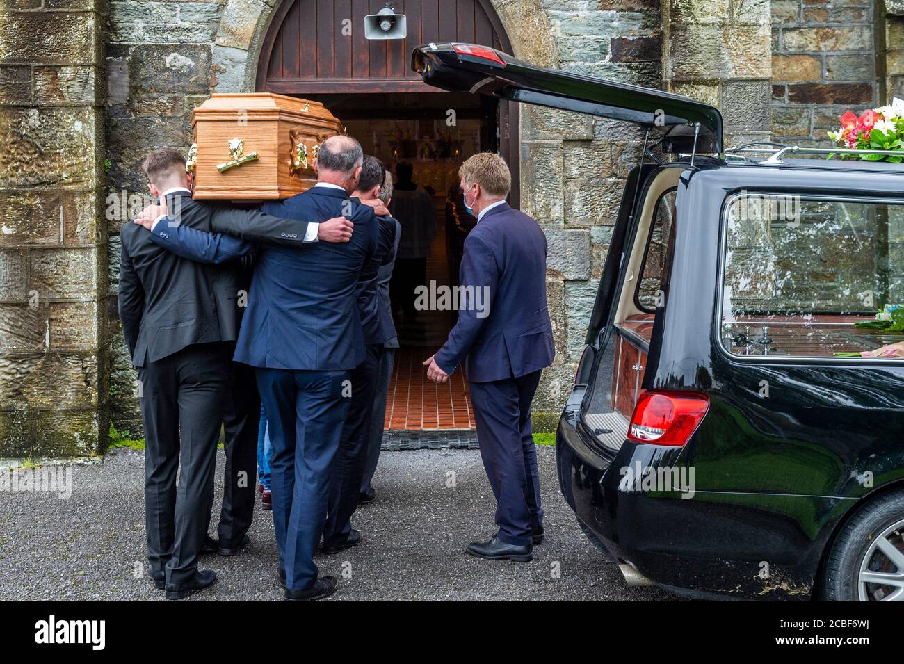 Goleen, West Cork, Ireland. 13th Aug, 2020. Ex Fine Gael TD Paddy Sheehan's  funeral took place at Church of our Lady, Star of the Sea and St. Patrick's in Goleen, West Cork today.   The coffin is carried into the church for the funeral service. Credit: AG News/Alamy Live News Stock Photo