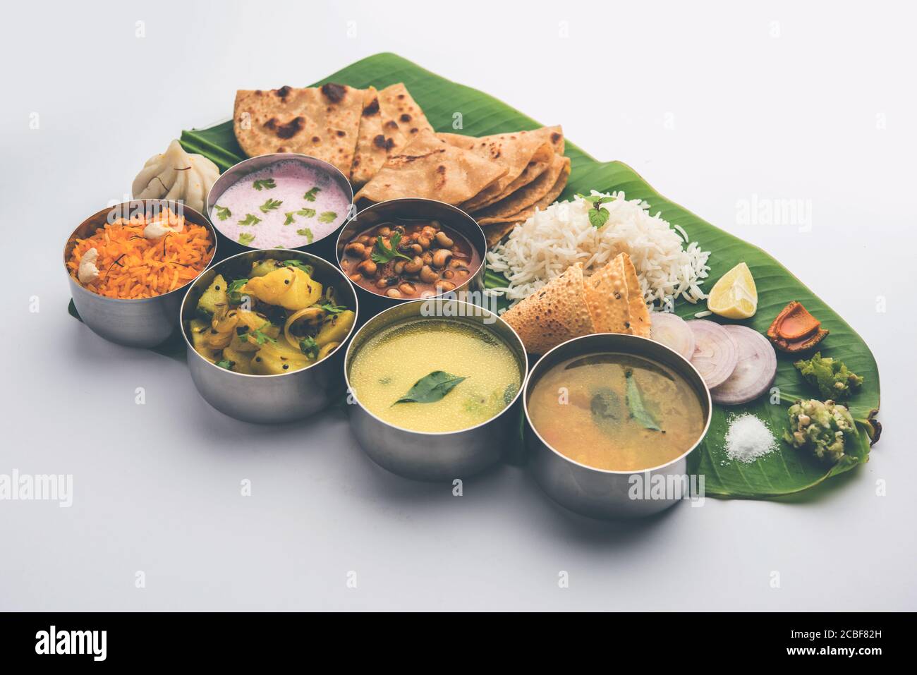 Maharashtrian food Thali or platter - Mumbai style Meal from Indian State Maharashtra includes, roti, rice, dal, sabji, sweet roti and rice, kadhi, Mo Stock Photo