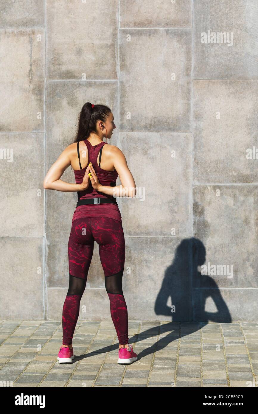 Hands clasped behind back hires stock photography and images Alamy