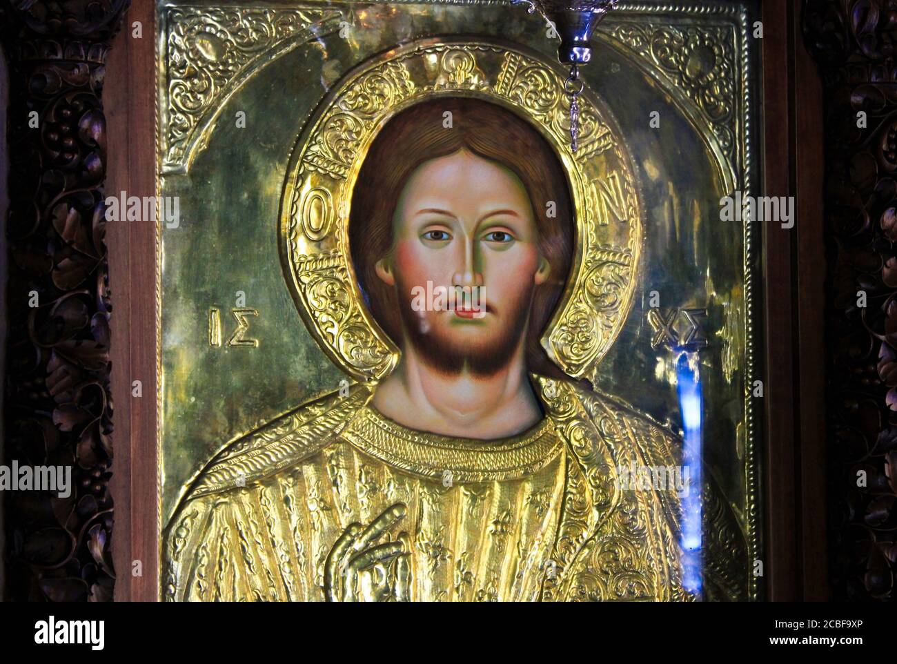 Greece, Athens, August 11 2020 - Icon of Jesus Christ, handcrafted and covered with gold, inside a Christian orthodox church. Stock Photo