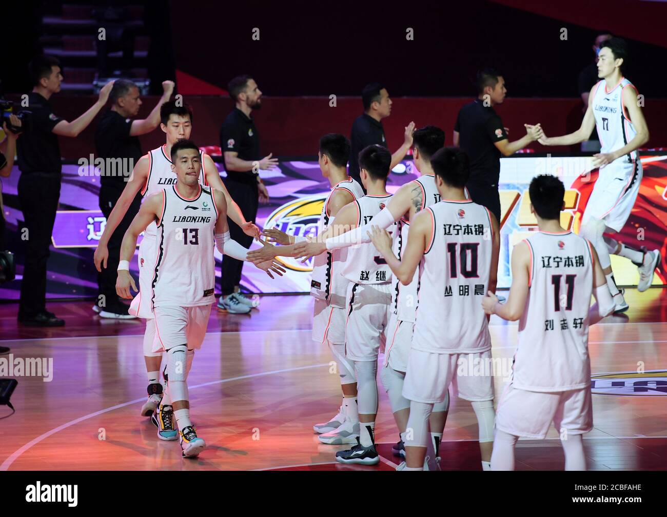 Qingdao, China's Shandong Province. 13th Aug, 2020. Players of Liaoning Flying Leopards step onto the court ahead of the second game of the finals between Guangdong Southern Tigers and Liaoning Flying Leopards at the 2019-2020 Chinese Basketball Association (CBA) league in Qingdao, east China's Shandong Province, Aug. 13, 2020. Credit: Li Ziheng/Xinhua/Alamy Live News Stock Photo