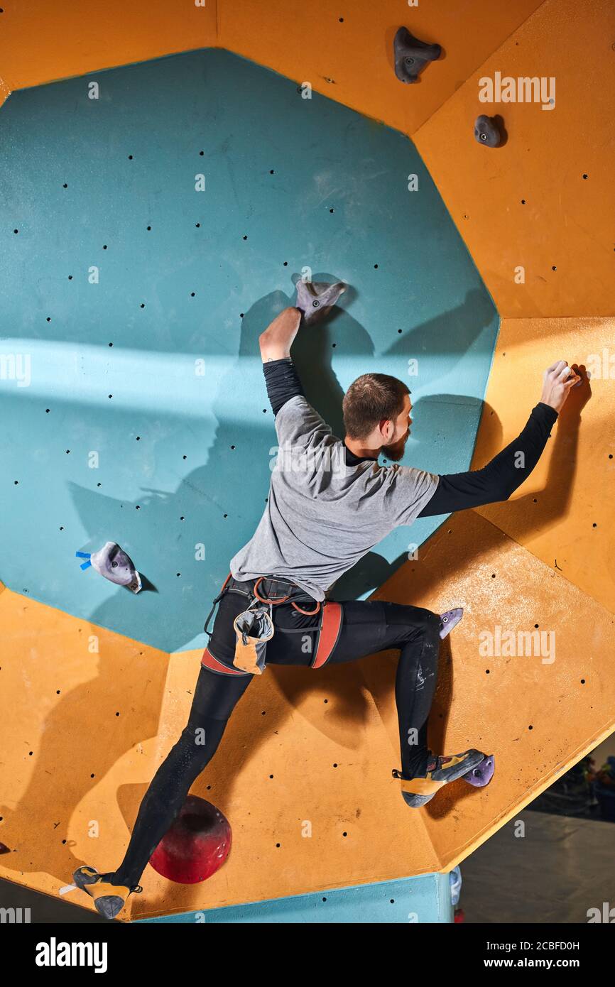 Vertical shot, full length view of unrecognizable young active man with