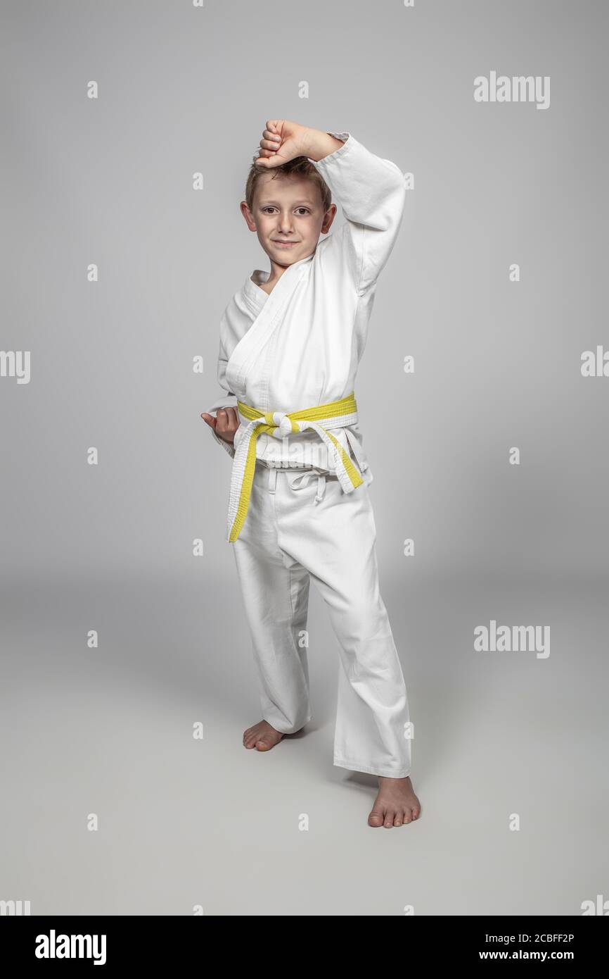 child practicing martial arts in age uke pose Stock Photo Alamy