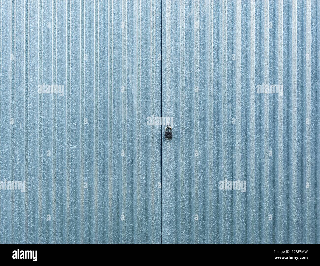 White corrugated metal gate. Stock Photo