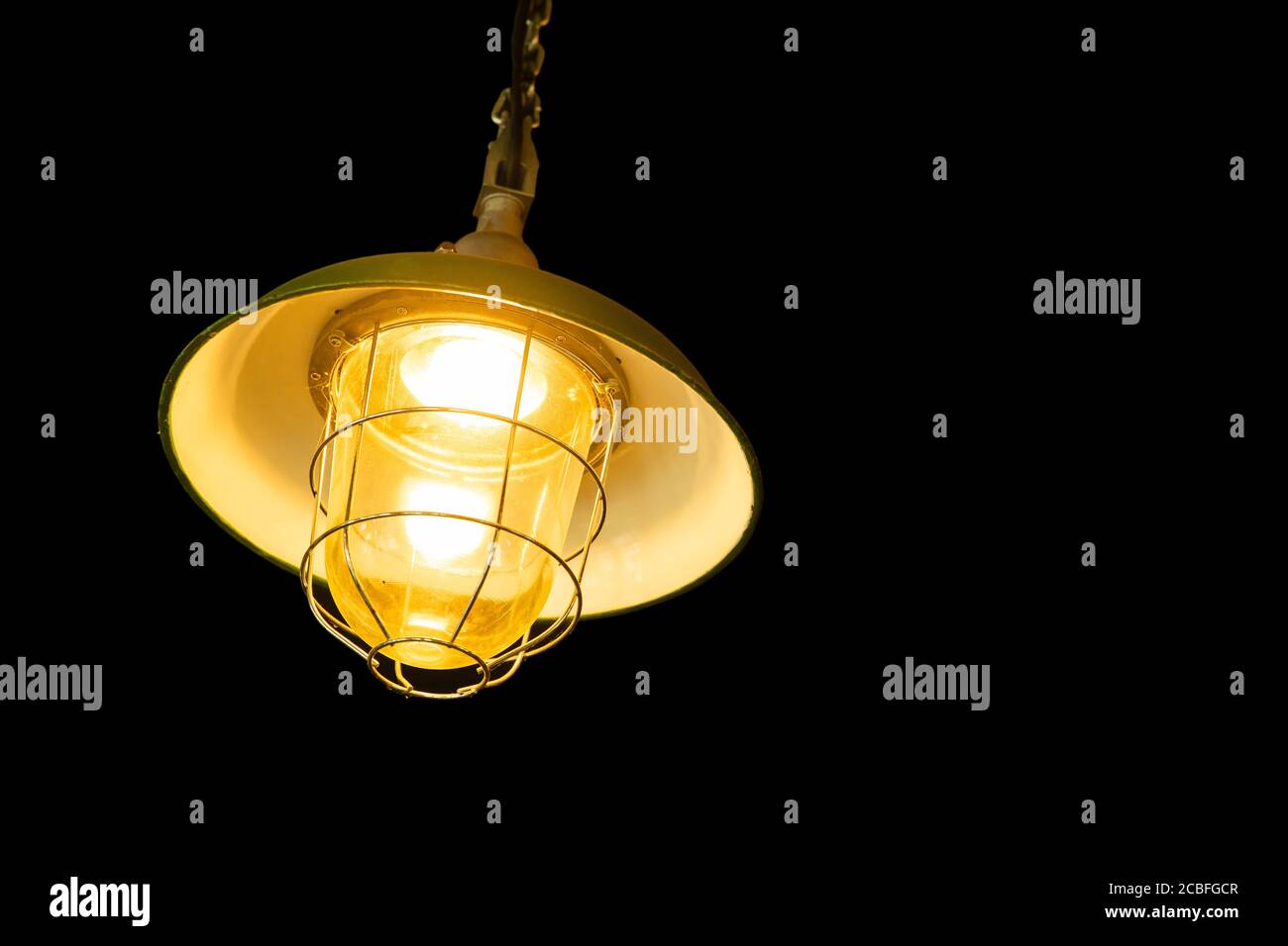 ceiling hanging light lamp isolated on black background Stock Photo