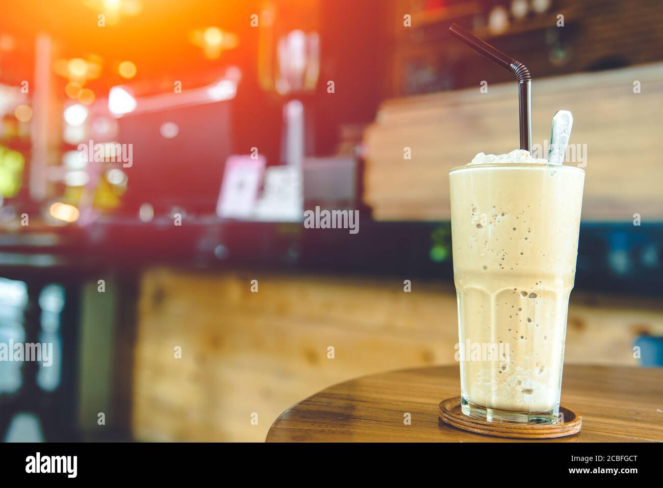 Coffee Smoothie milk shake sweet cool ice blended drink with caffeine refresh menu on coffee shop table with space for text Stock Photo