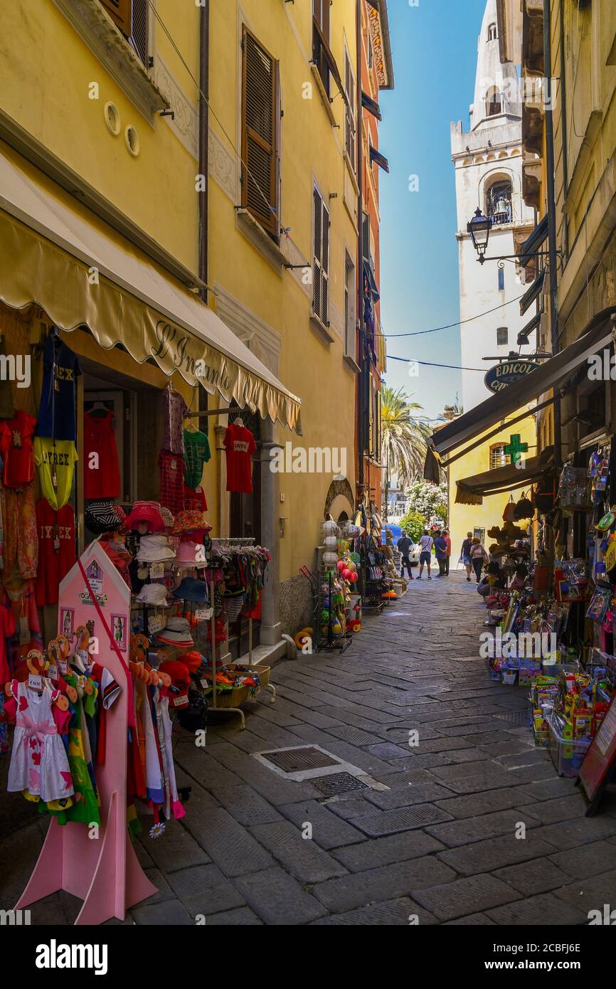 A narrow alley in the historic centre of the old fishing village with souvenir shops and people in summer, Lerici, La Spezia, Liguria, Italy Stock Photo