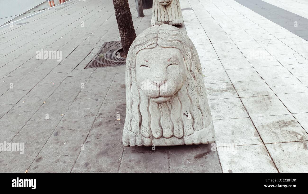 Iconic lion statue in the main shopping street Drottninggatan in Stockholm Stock Photo