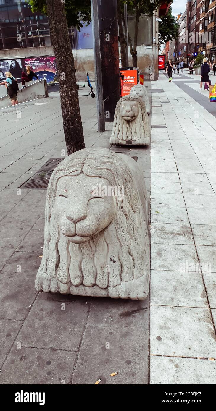 Iconic lion statue in the main shopping street Drottninggatan in Stockholm Stock Photo