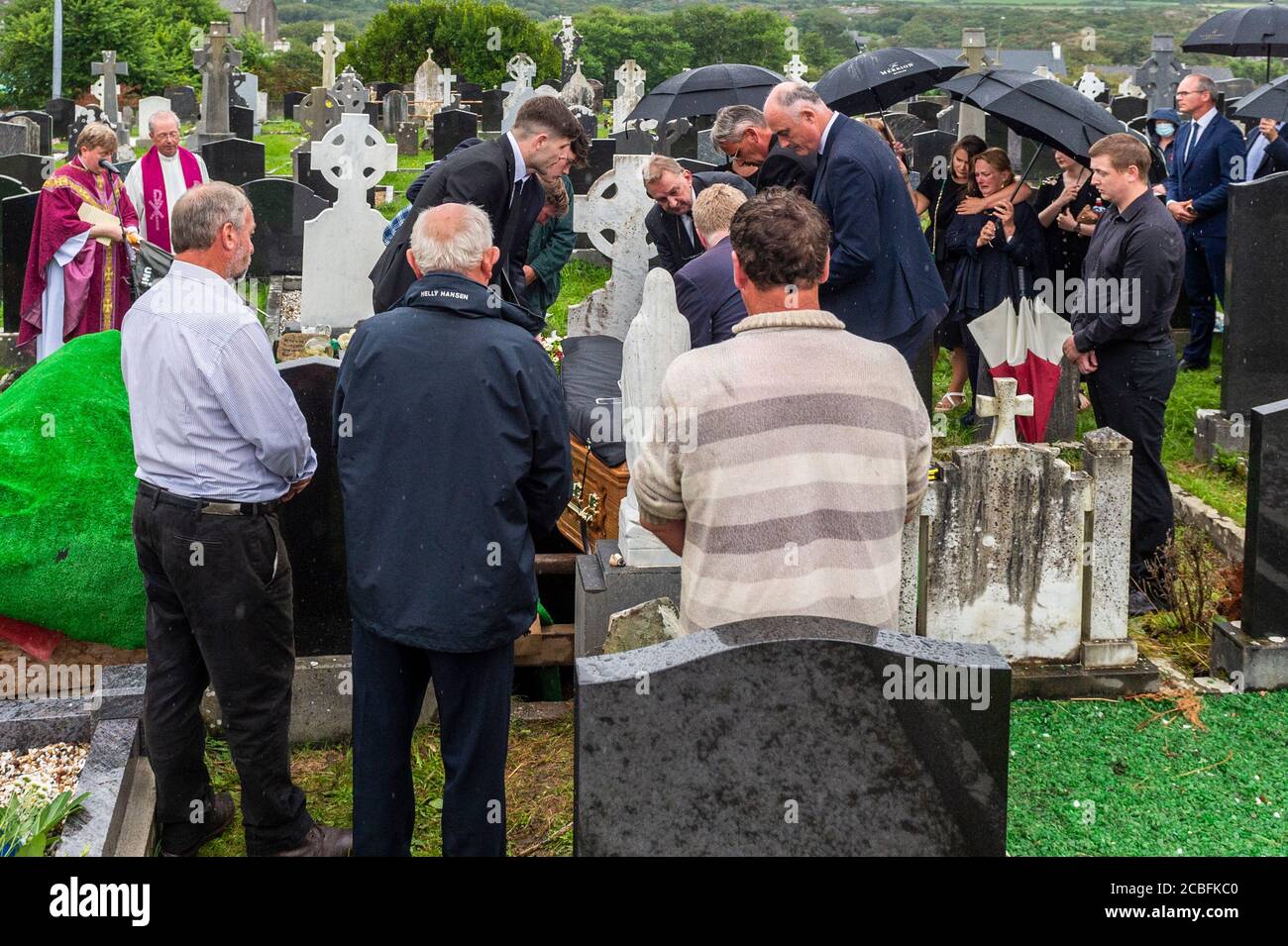 Goleen, West Cork, Ireland. 13th Aug, 2020. Ex Fine Gael TD Paddy Sheehan's  funeral took place at Church of our Lady, Star of the Sea and St. Patrick's in Goleen, West Cork today.   Paddy Sheehan is carried to his final resting place. Credit: AG News/Alamy Live News Stock Photo